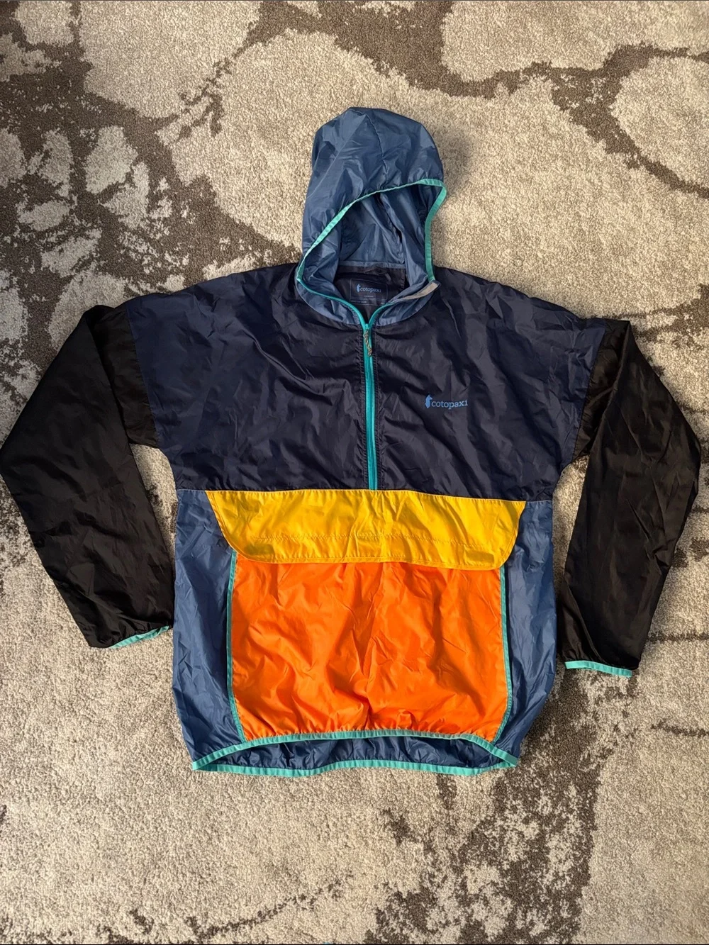 cotopaxi Navy Windbreaker with Orange and Yellow Colorblock